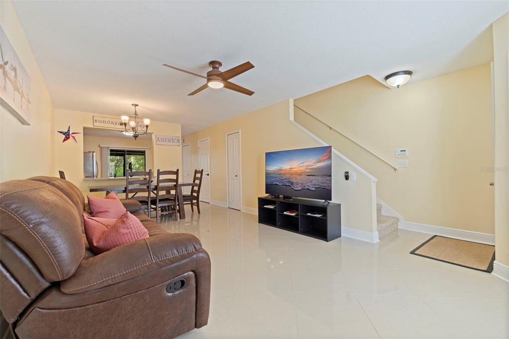 5100 Burchette Road, Unit 2301 Tampa, FL 33647 - Photo 7 of 39 a living room with furniture and a flat screen tv