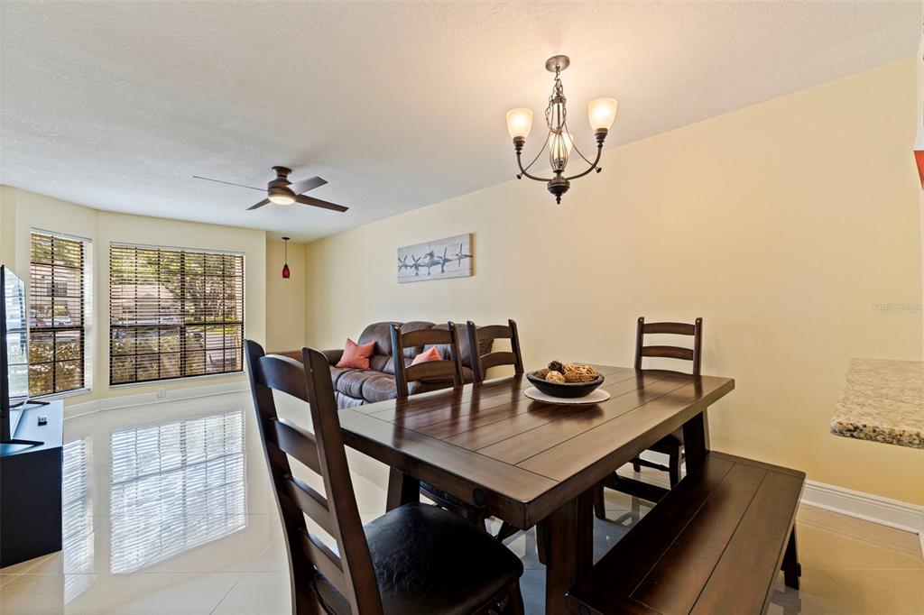 5100 Burchette Road, Unit 2301 Tampa, FL 33647 - Photo 10 of 39 a view of a dining room with furniture window and outside view