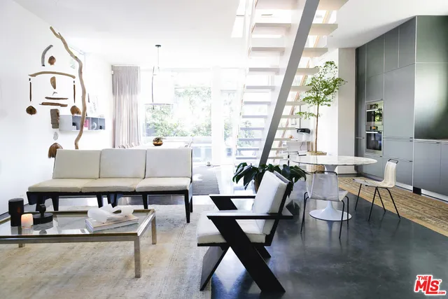 a view of a livingroom with furniture and a flat screen tv