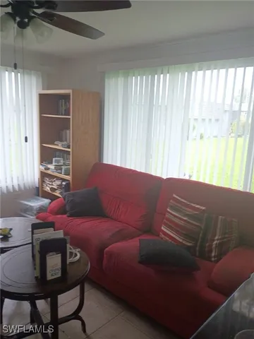a living room with furniture and a window