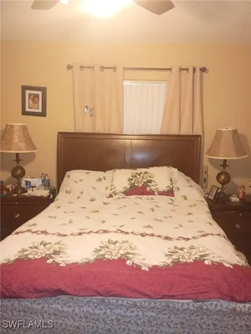 a view of a bedroom with a bed