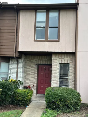 a front view of a house with garage