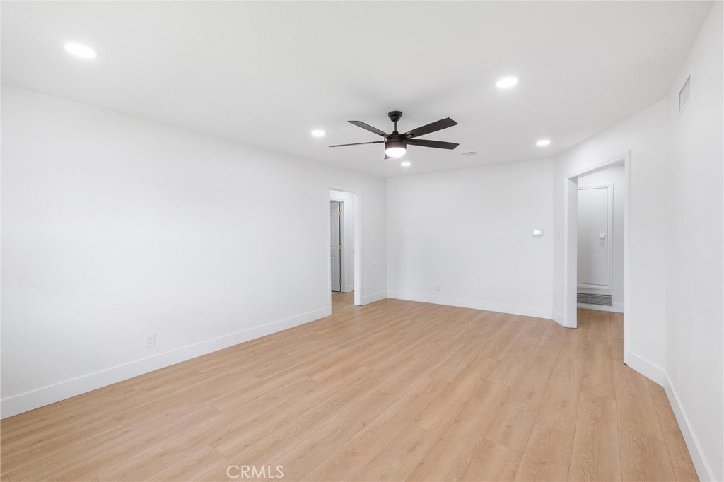10597 Pendleton Street Riverside, CA 92505 - Photo 19 of 40 a view of an empty room with a ceiling fan