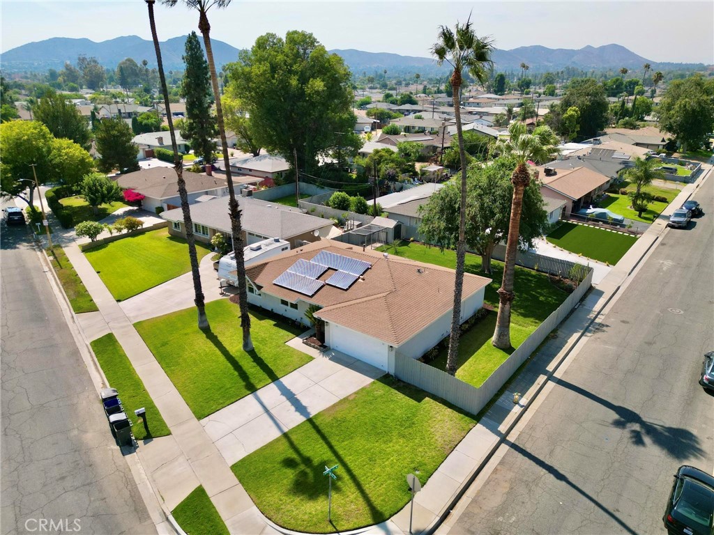 10597 Pendleton Street Riverside, CA 92505 - Photo 2 of 40 an aerial view of a house with a garden and swimming pool