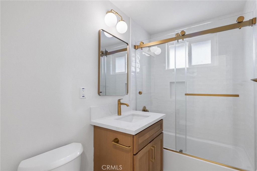 10597 Pendleton Street Riverside, CA 92505 - Photo 28 of 40 a bathroom with a sink a toilet and shower