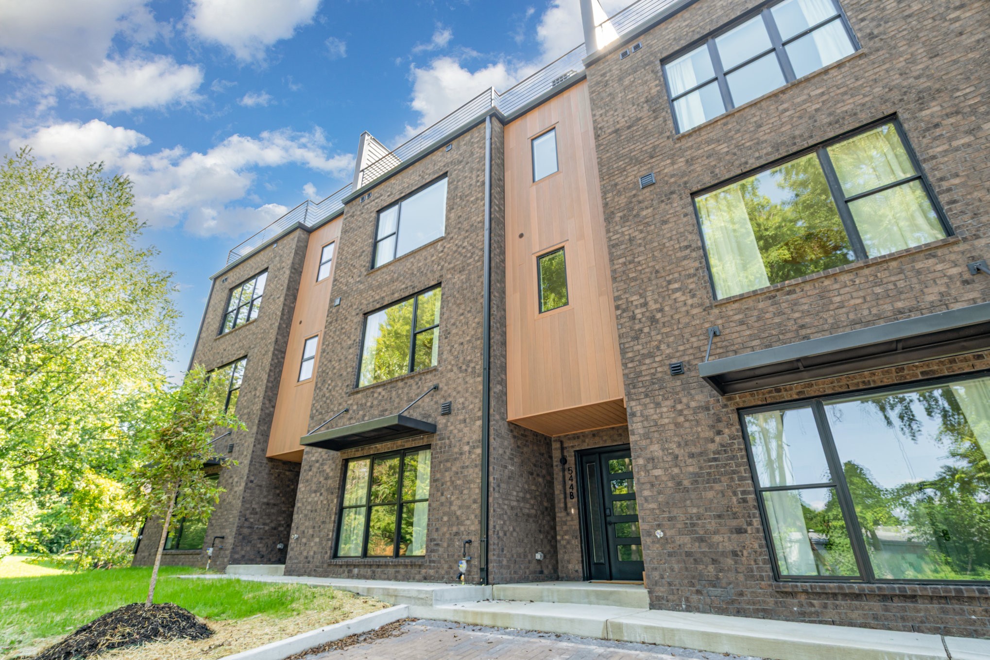 542 D Rosedale Avenue, Unit 7 Nashville, TN 37211 - Photo 26 of 33 a view of a brick building next to a yard
