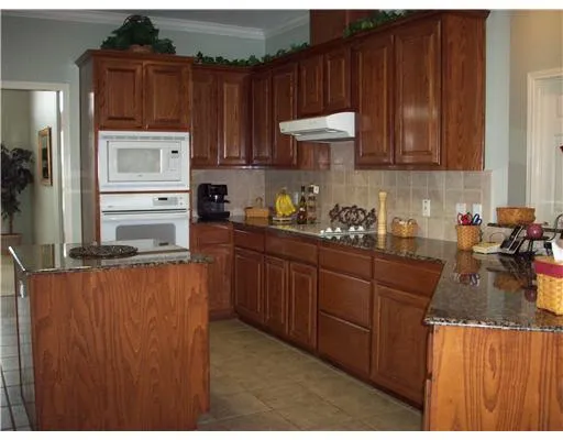 a kitchen with sink cabinets and window