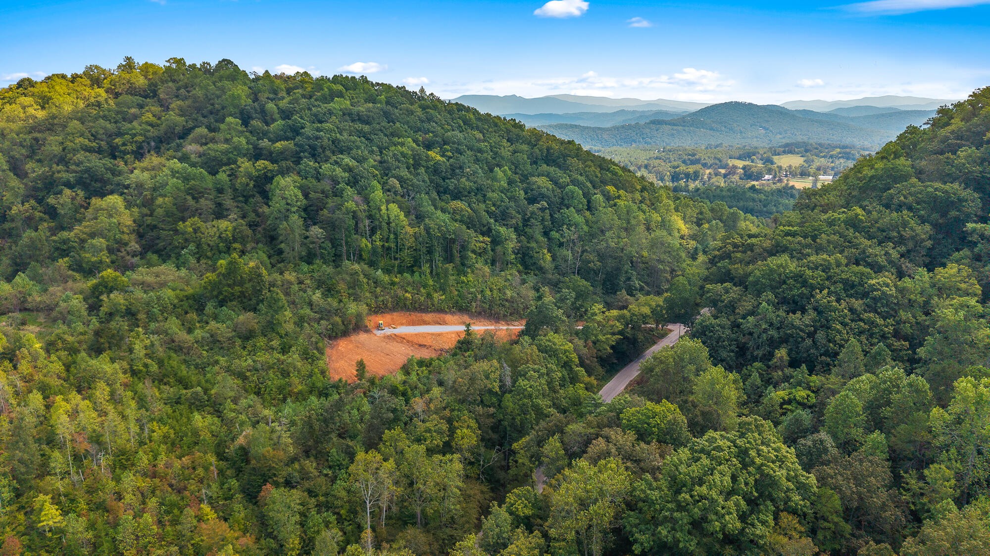 1776 Fairview Road Tellico Plains, TN 37385 - Photo 7 of 9 an aerial view of a house with a yard