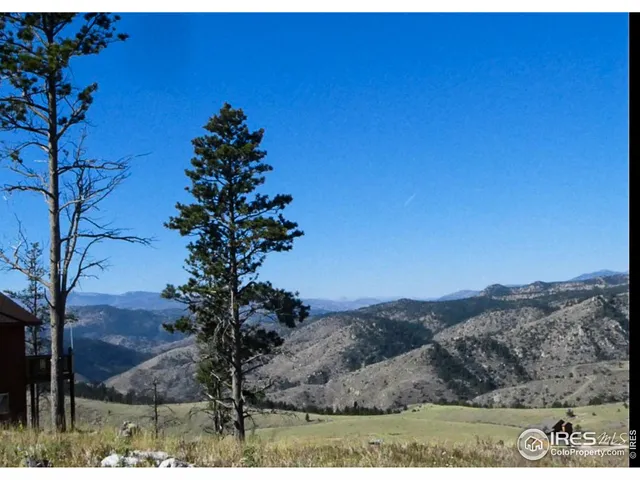 a view of ocean with a mountain