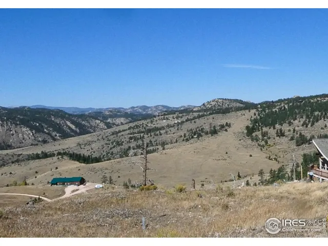 a view of a beach with a mountain in the background