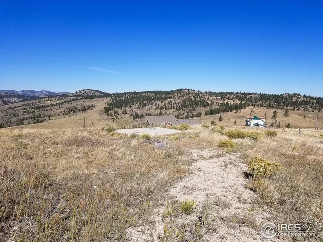 a view of a large body of water with a building in the background
