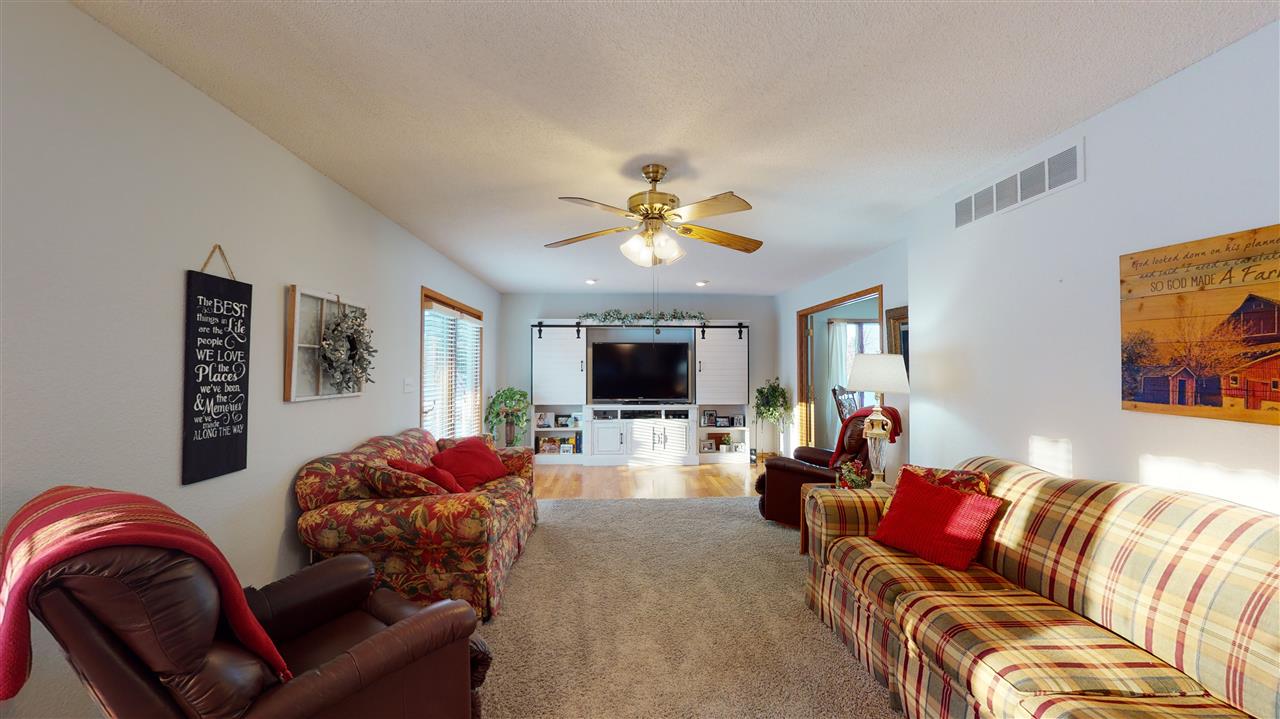 3028 South Golf Road Stockton, IL 61085 - Photo 11 of 26 a living room with furniture and a flat screen tv