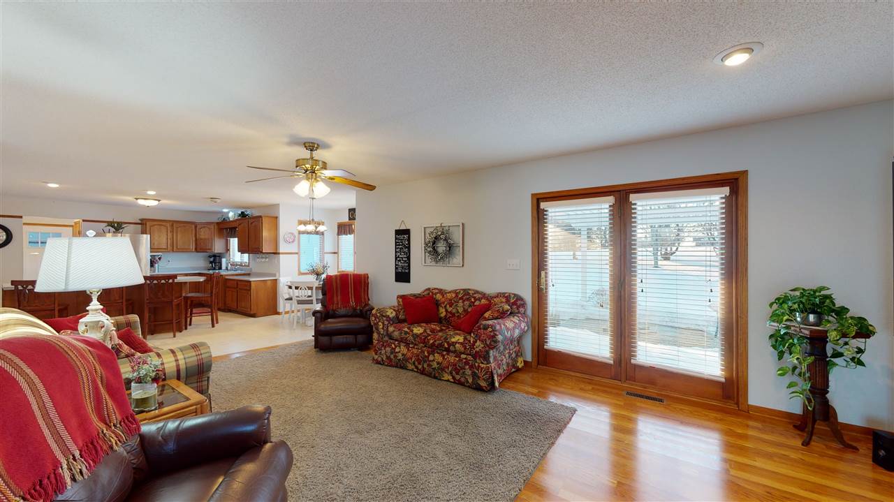 3028 South Golf Road Stockton, IL 61085 - Photo 12 of 26 a living room with furniture and wooden floor