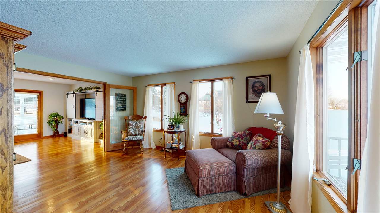 3028 South Golf Road Stockton, IL 61085 - Photo 14 of 26 a living room with furniture and a large window