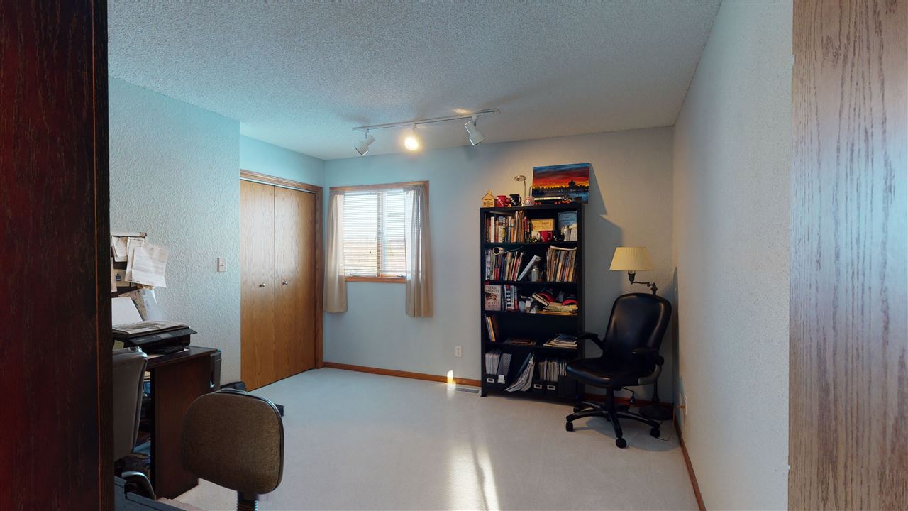 3028 South Golf Road Stockton, IL 61085 - Photo 18 of 26 a view of a workspace with furniture and a window