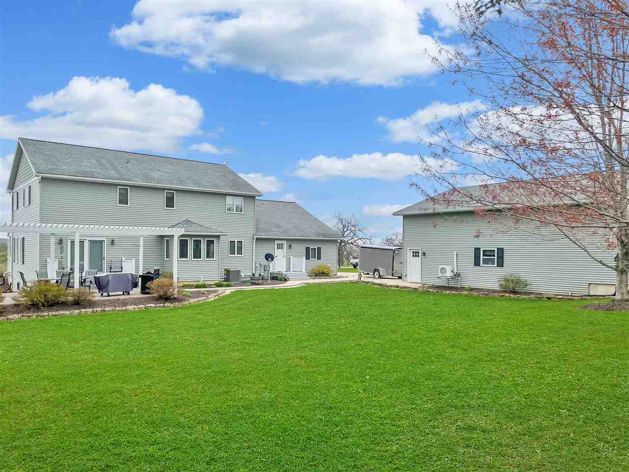3028 South Golf Road Stockton, IL 61085 - Photo 26 of 26 a view of a house with a big yard plants and large trees