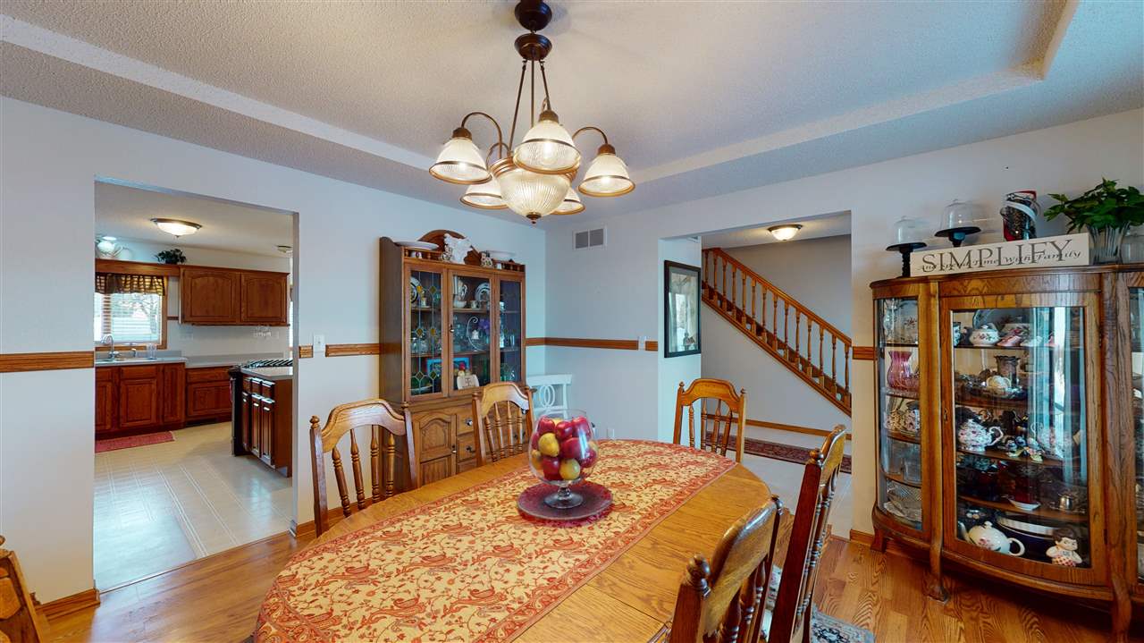 3028 South Golf Road Stockton, IL 61085 - Photo 5 of 26 a view of a dining room with furniture and wooden floor