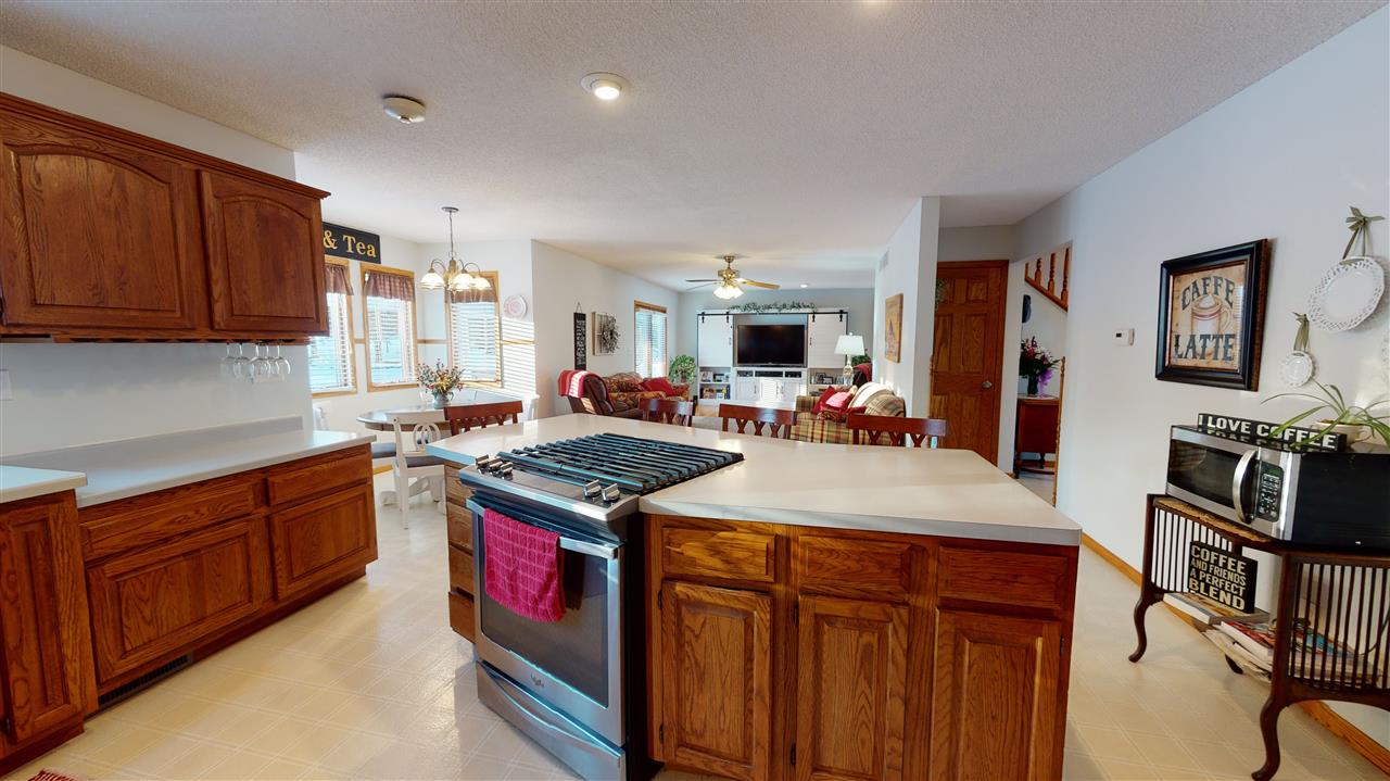 3028 South Golf Road Stockton, IL 61085 - Photo 7 of 26 a kitchen with stainless steel appliances granite countertop a stove and a sink