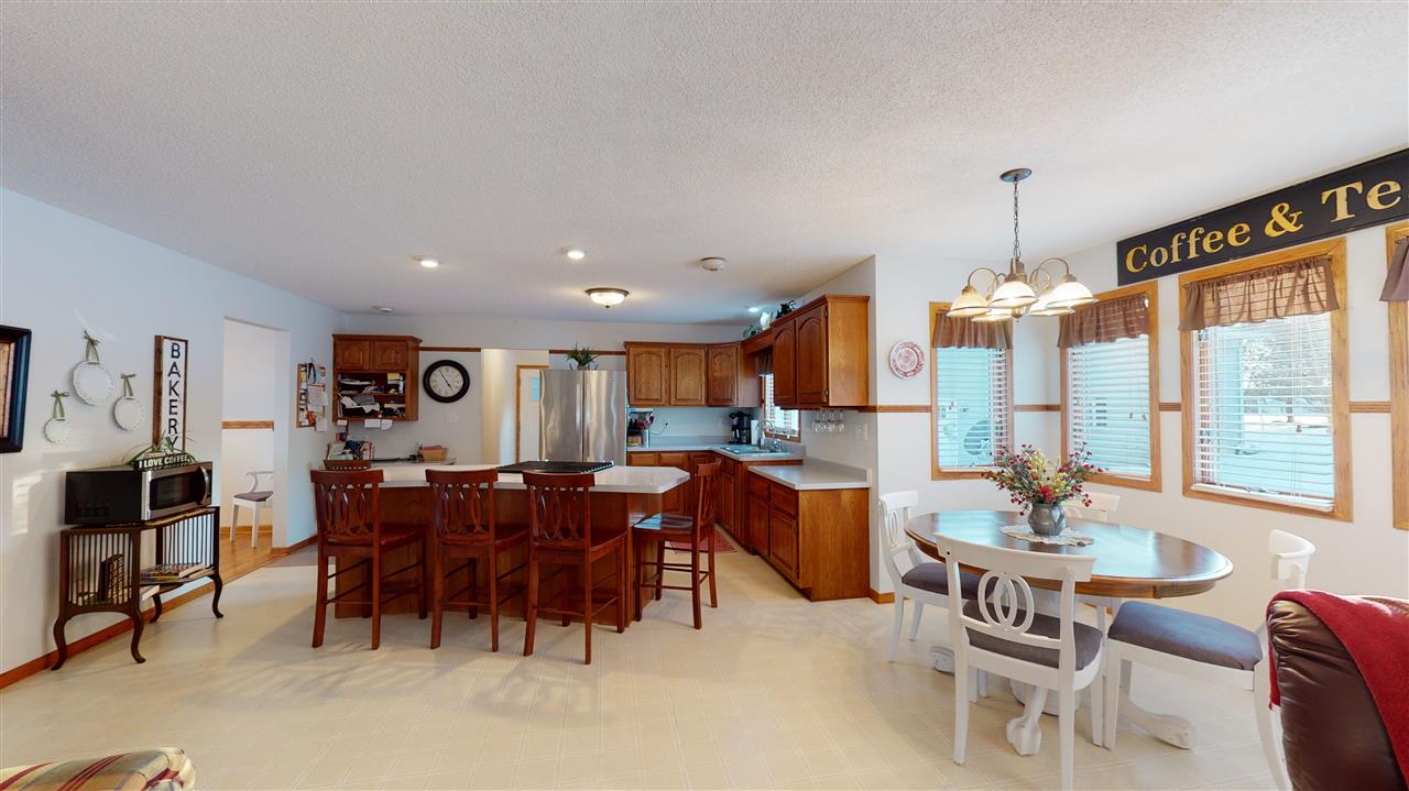 3028 South Golf Road Stockton, IL 61085 - Photo 9 of 26 a view of a dining room with furniture window and outside view