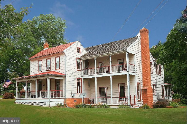 795 Trevanion Road Union Bridge, MD 21791 - Photo 1 of 1 a front view of a house with a garden