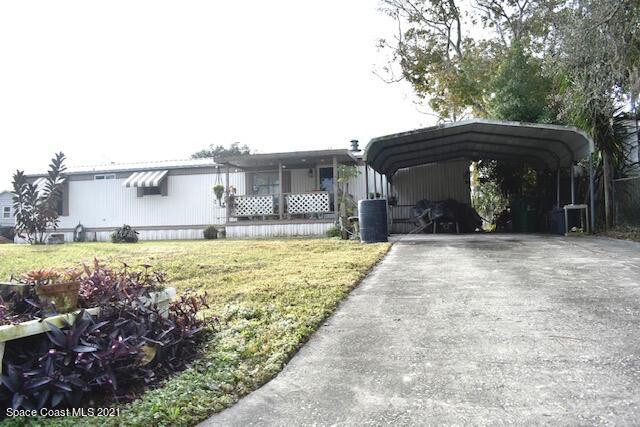 3315 Brockett Road Mims, FL 32754 - Photo 1 of 27 a view of a house with a yard