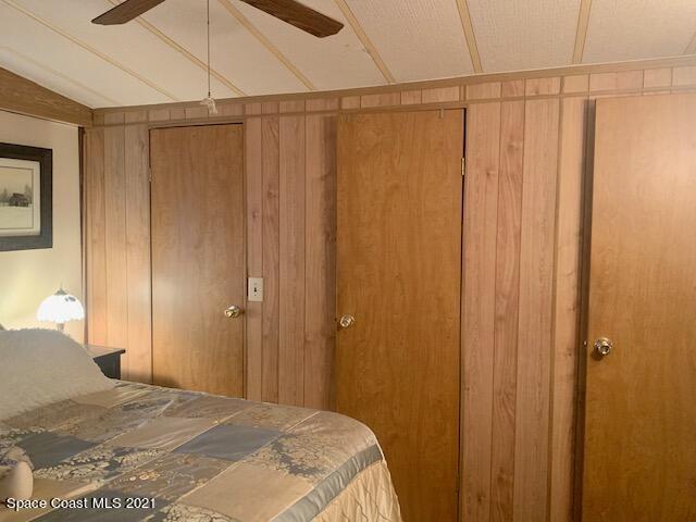 3315 Brockett Road Mims, FL 32754 - Photo 14 of 27 a bedroom with a bed and a curtain