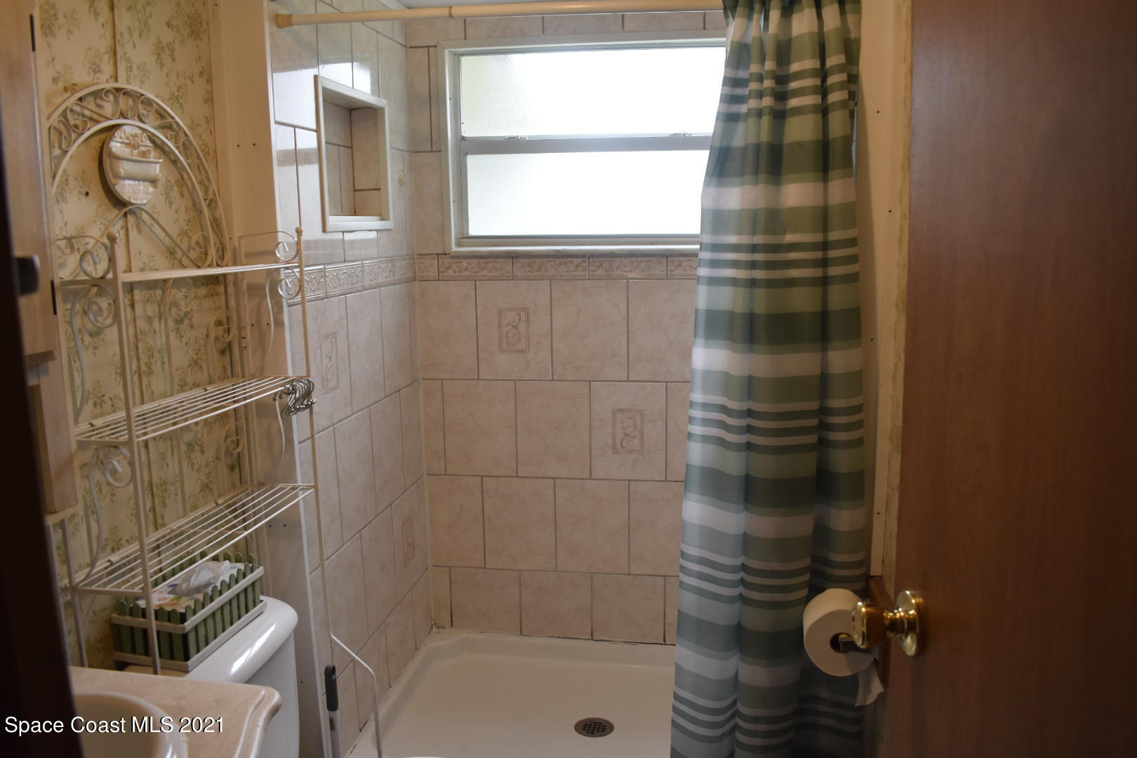 3315 Brockett Road Mims, FL 32754 - Photo 18 of 27 a bathroom with a shower