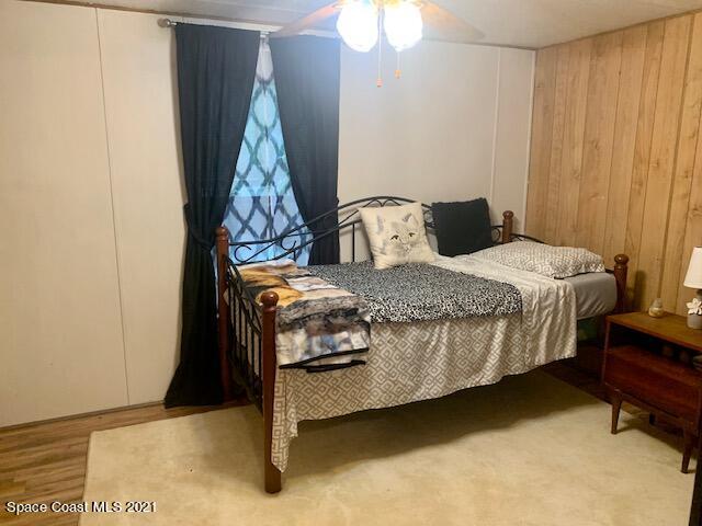 3315 Brockett Road Mims, FL 32754 - Photo 19 of 27 a bedroom with a bed and a cabinet