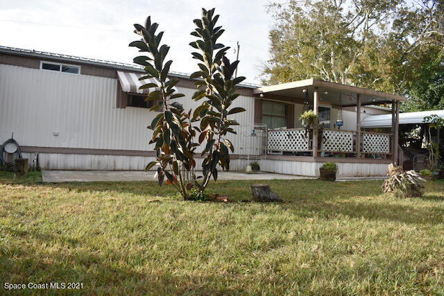 3315 Brockett Road Mims, FL 32754 - Photo 3 of 27 a view of a house with a yard