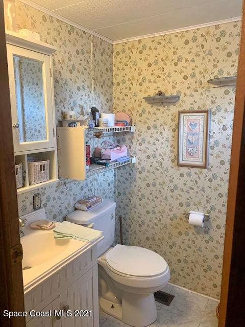 3315 Brockett Road Mims, FL 32754 - Photo 21 of 27 a bathroom with a sink and a toilet