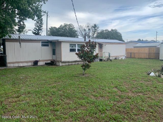 3315 Brockett Road Mims, FL 32754 - Photo 26 of 27 a front view of a house with garden