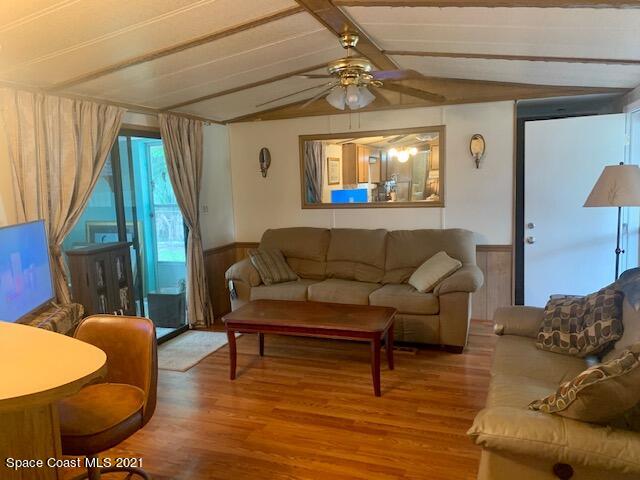 3315 Brockett Road Mims, FL 32754 - Photo 5 of 27 a living room with furniture and a wooden floor