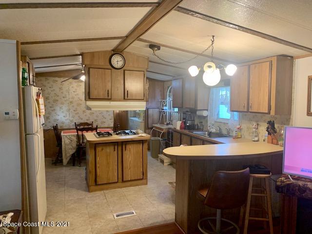 3315 Brockett Road Mims, FL 32754 - Photo 6 of 27 a kitchen with a sink appliances and cabinets