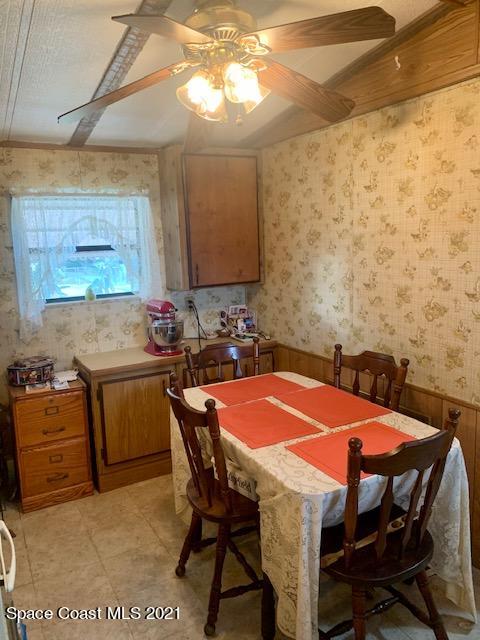 3315 Brockett Road Mims, FL 32754 - Photo 8 of 27 a table with chairs and a stove top oven