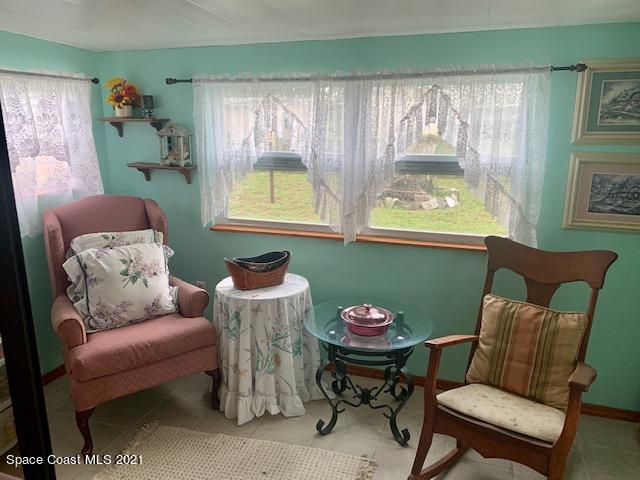 3315 Brockett Road Mims, FL 32754 - Photo 10 of 27 a living room with furniture and a window