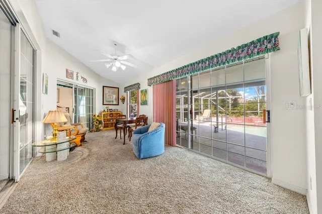 a living room with furniture a chandelier