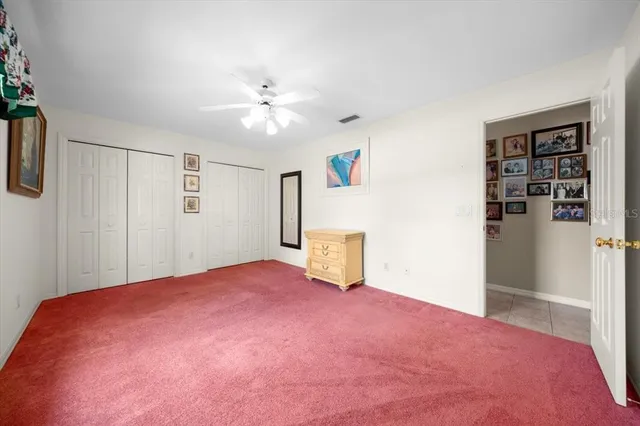 a view of empty room with closet and fan