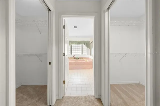 a view of a bathroom from a corridor
