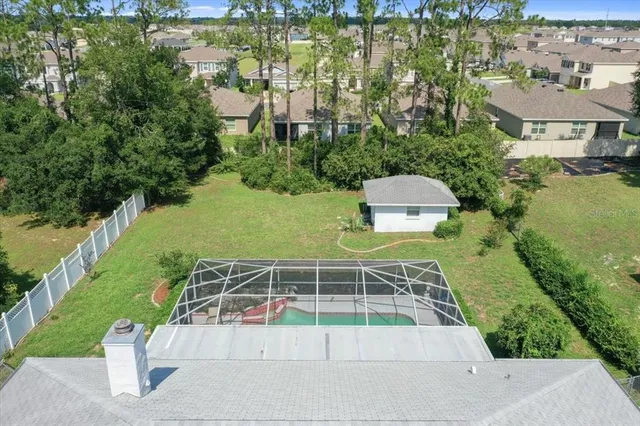 an aerial view of a house having yard