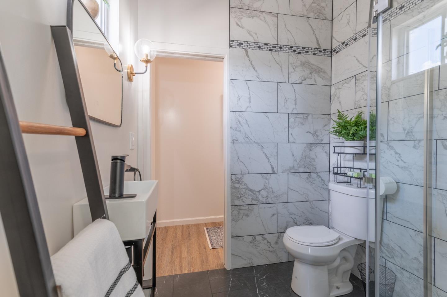 416 Front Street Salinas, CA 93901 - Photo 13 of 48 a white toilet sitting next to a bathroom sink