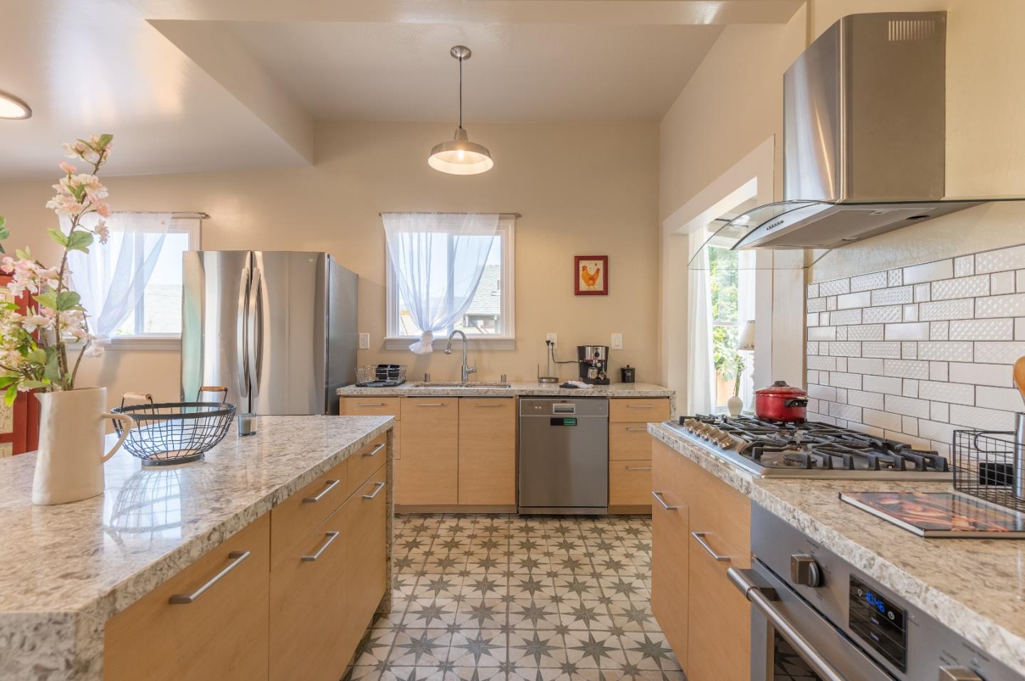 416 Front Street Salinas, CA 93901 - Photo 26 of 48 a kitchen with stainless steel appliances granite countertop a sink stove and refrigerator
