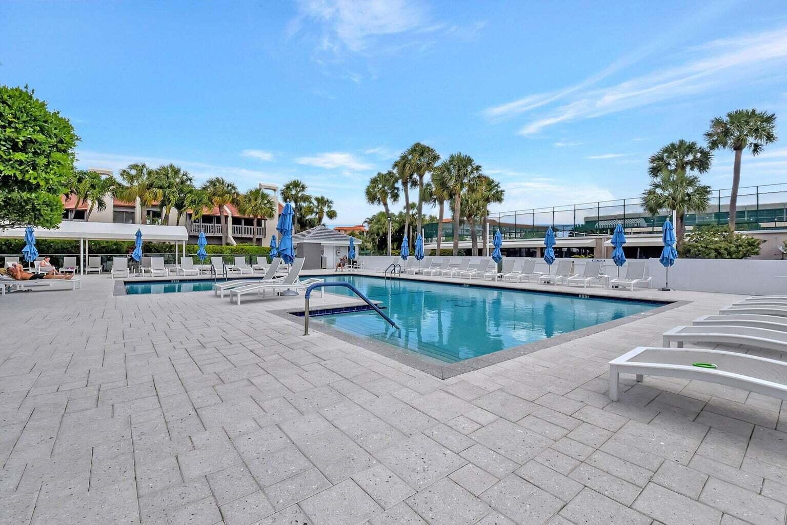 2707 North Ocean Boulevard, Unit D205 Boca Raton, FL 33431 - Photo 34 of 51 a view of a swimming pool with outdoor seating