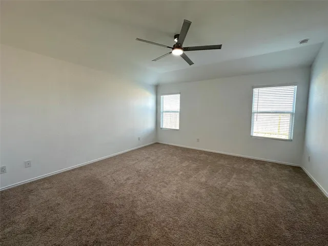 a large kitchen with kitchen island a counter top space stainless steel appliances and cabinets