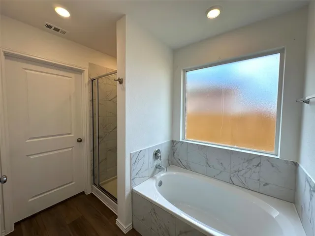 a bathroom with a sink a mirror and a shower