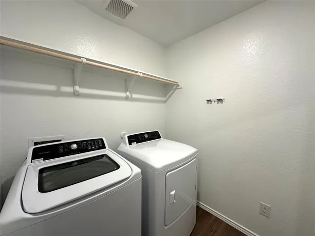a white toilet sitting next to a shower