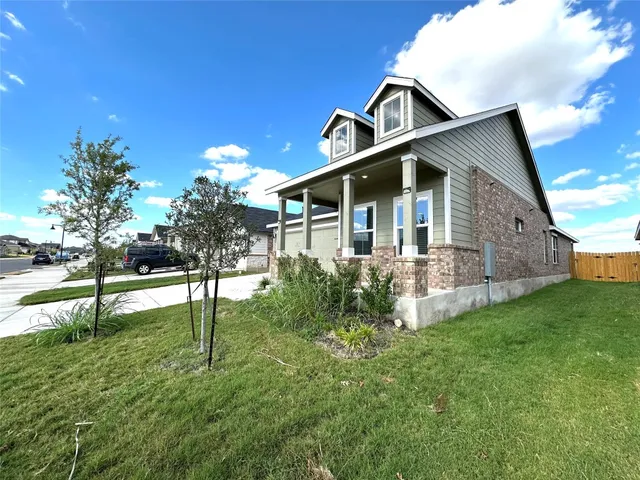 a front view of house with garden