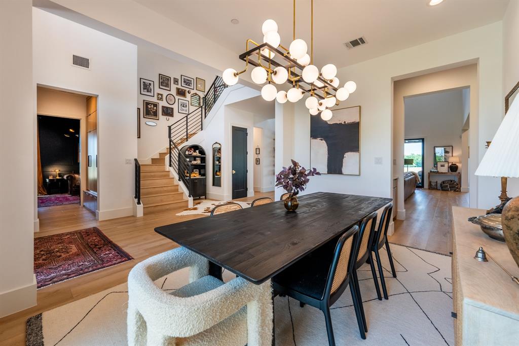 2396 County Road 2145 Cooper, TX 75432 - Photo 8 of 40 a view of a dining room with furniture and chandelier