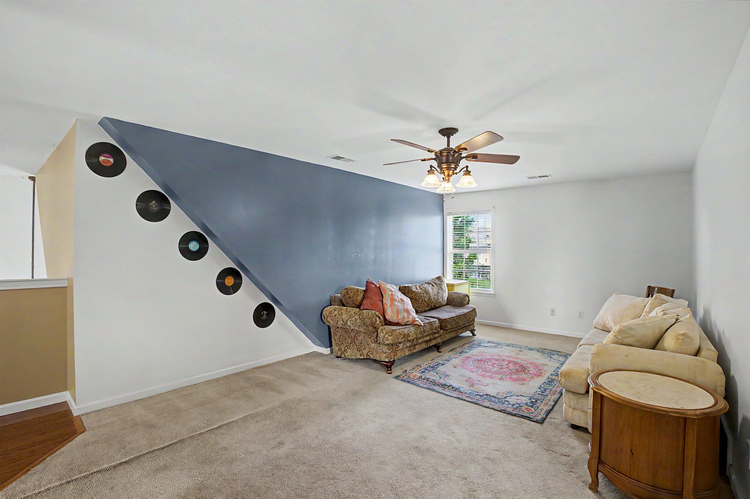 134 Rembert Drive Atoka, TN 38004 - Photo 33 of 38 Spacious room featuring a partial accent wall, ceiling fan, and window