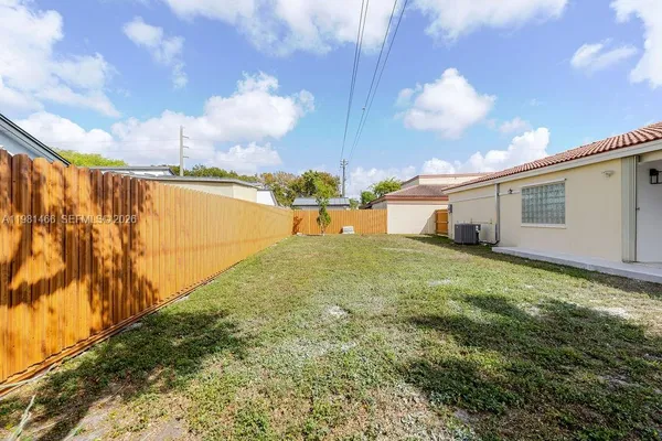 a view of an house with backyard space