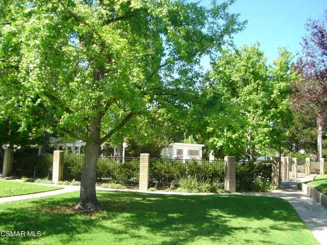 a view of a building with a yard